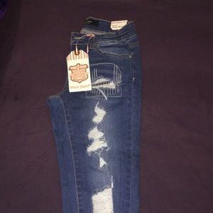 Wax distressed denim jeans